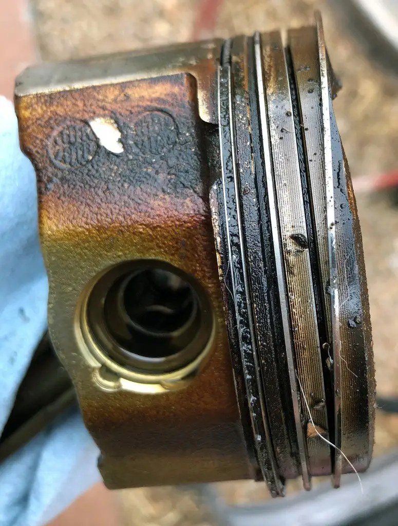 Carbon-coked piston rings and gummed oil-control ring from an engine with oil consumption