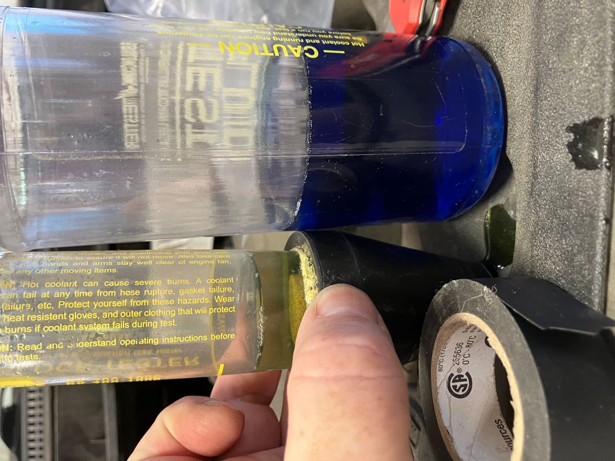 Block tester showing positive result for combustion gases in coolant, confirming head gasket failure
