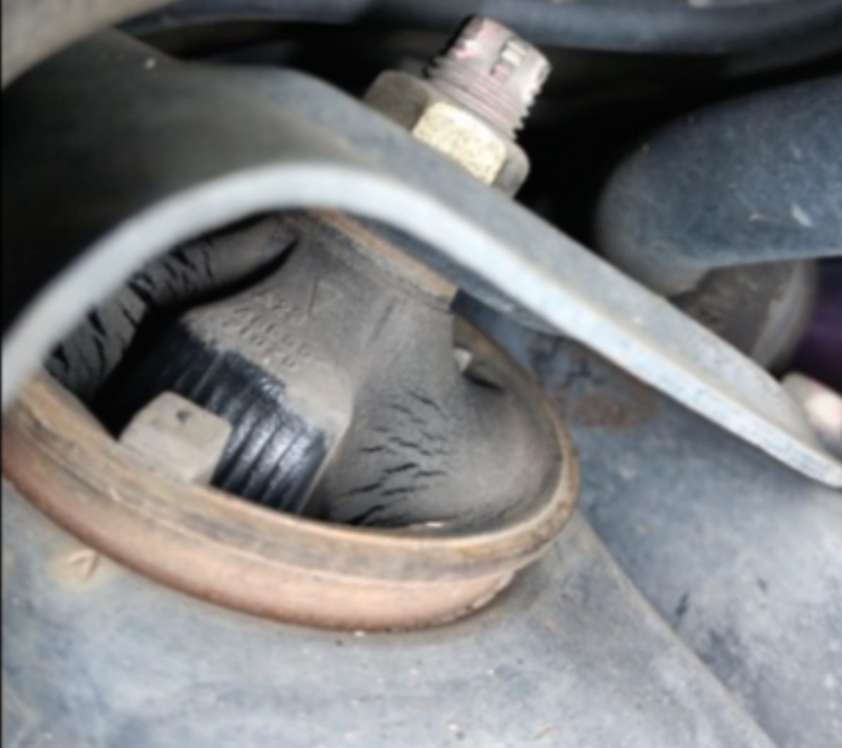 Second view of normal surface cracking on a control arm bushing - the rubber is intact, not torn or separated